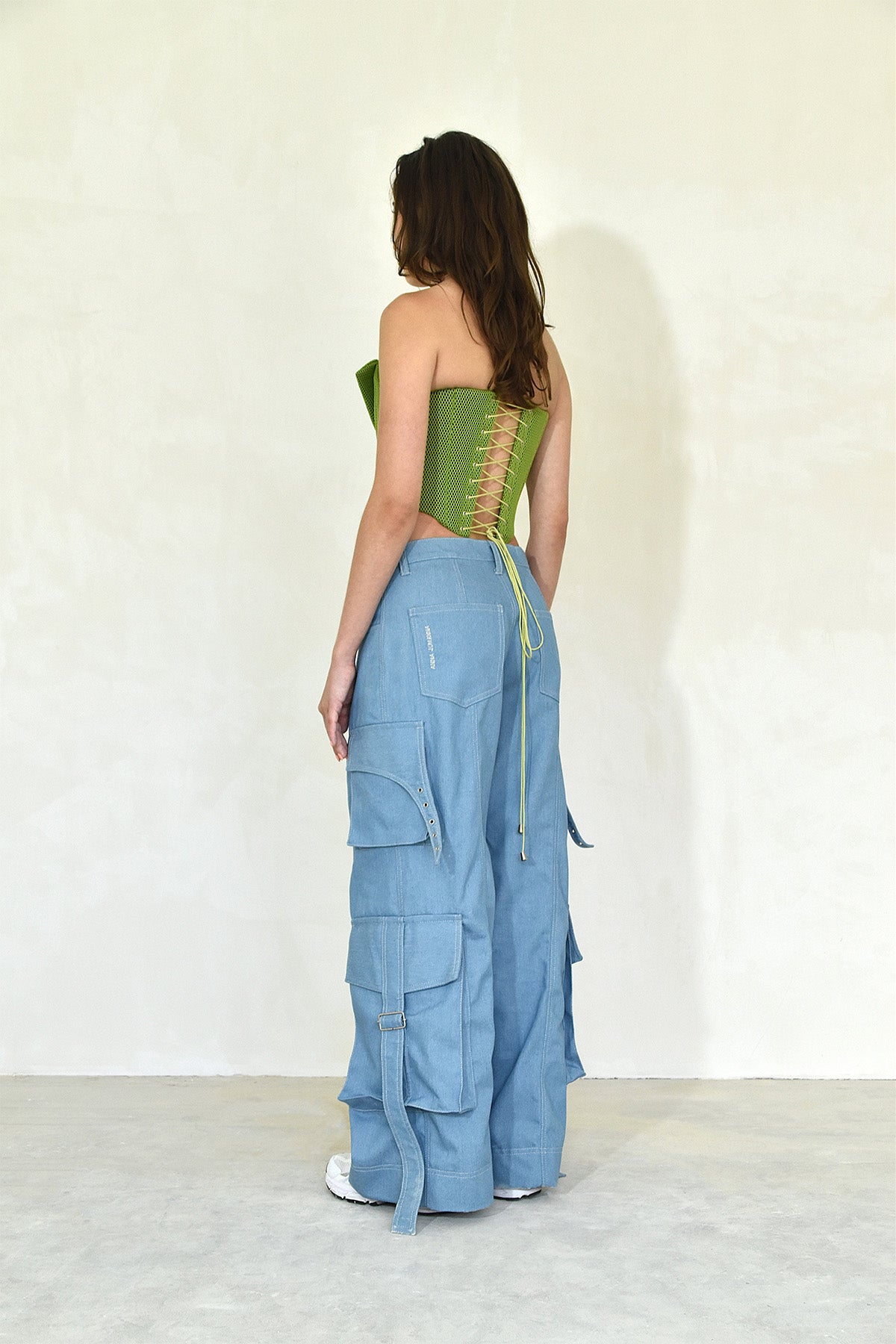Green neoprene corset side back view